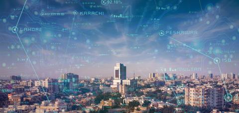 The city of Karachi, Pakistan with neon technological text overlayed