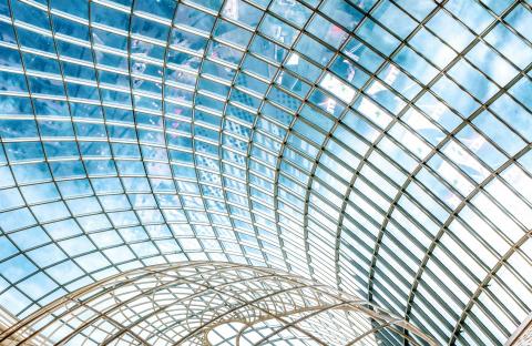 A glass building with a round ceiling